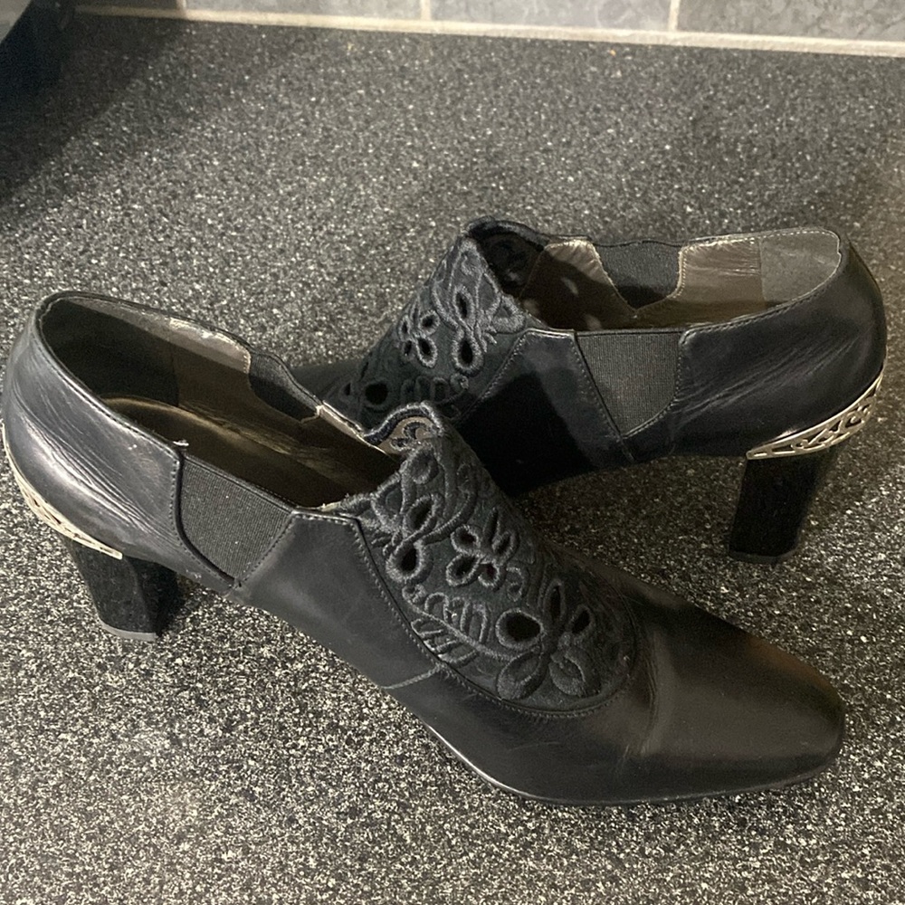 Fun slip on boots.  Black with silver on the heel.  Brighton Rand.  Size 10